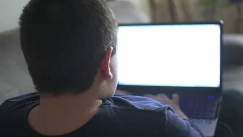 Young boy typing on laptop Stock Footage 152958301