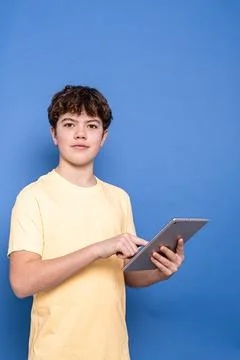 Young boy using digital tablet for learning and connection Stock Photos