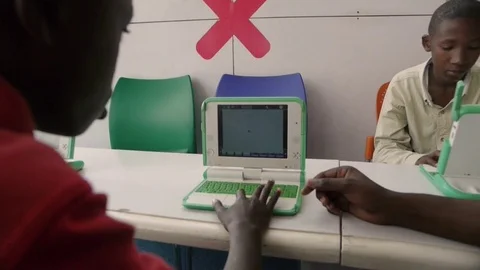 Young boy using his laptop in a classroom in Kigali, Rwanda Stock Footage 72648867