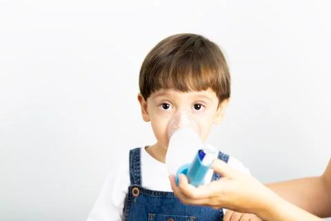 Young Boy Using Inhaler Stock Photos