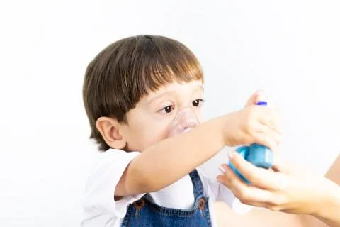 Young Boy Using Inhaler Stock Photos