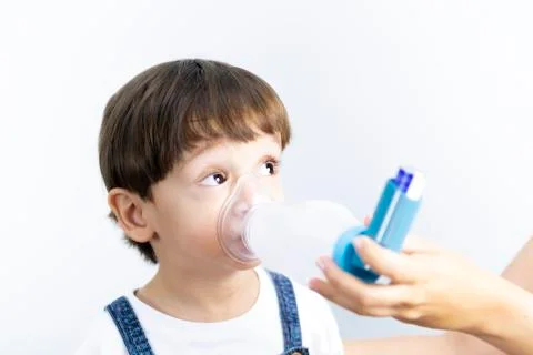 Young Boy Using Inhaler Stock Photos
