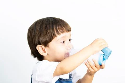 Young Boy Using Inhaler Stock Photos