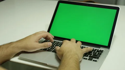 Young boy using a laptop computer and typing  Stock Footage 68500935