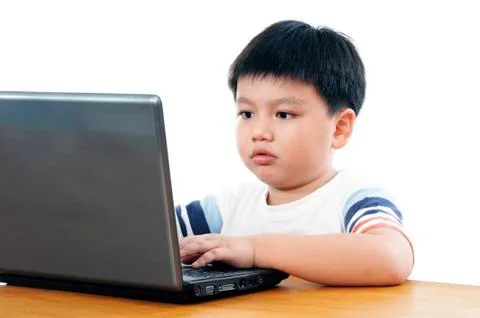 Young boy using laptop Stock Photos