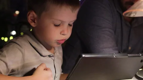 Young boy using laptop at table. Stock Footage 276204211