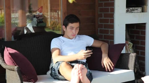 Young boy using a phone 2 HD 1080p Video stock 7765017