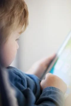 Young boy using smart tablet Stock Photos