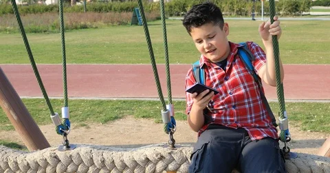 Young boy using smartphone 17 Stock Footage 88402144