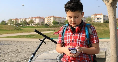 Young boy using smartphone 9 Stock Footage 88398308