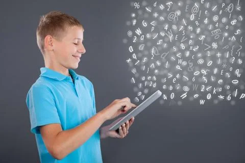 Young boy using tablet,school learning or technology concept Stock Photos