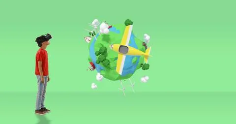 Young boy using VR headset exploring virtual world with 3D animated planet Stock Photos