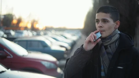 Young boy vaping with help of device for heating tobacco. Alternative of smoking Stock Footage 121483034