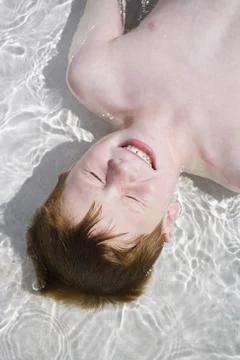 Young boy in wading pool Stock Photos