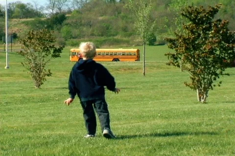 Young Boy Walking To a Bus Stock Footage 371711