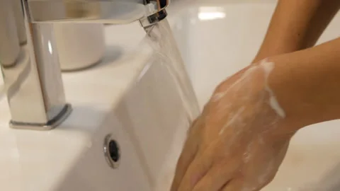 Young boy washes hands with soap gel. Stock Footage 149479162