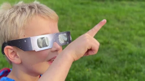 Young Boy Watches Eclipse With Safety Glasses 動画素材 343748864