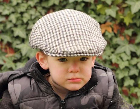 Young boy wearing a flat cap Stock Photos