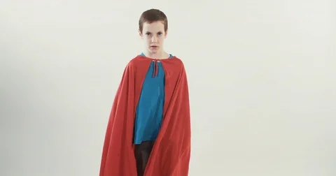 Young Boy wearing a red superman cape Stock Footage 69765138