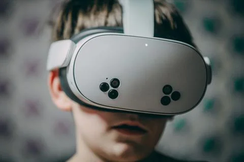 Young boy wearing virtual reality headset, immersed in digital experience, .. Stock Photos