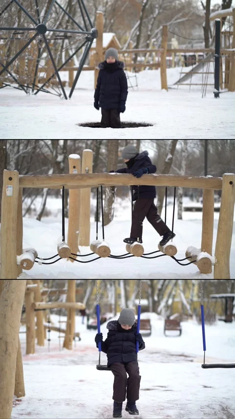 Young boy wearing winter jacket, hat and gloves plays on snowy playground.  Video stock 339373139