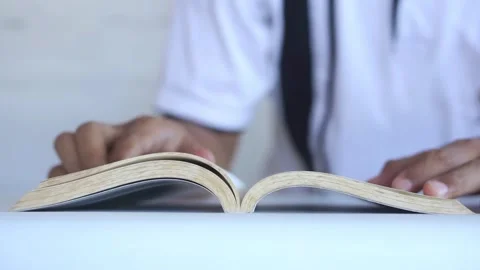 Young boy in white shirt reading opened book. Copy space. Stock Footage 322159461
