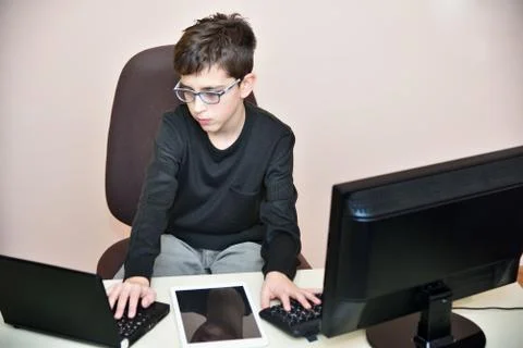 Young boy working on the computers Stock Photos