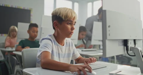 Young Boy Working on Creative Project on Computer, Practicing Digital Skills and Stock Footage 316294167