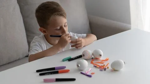 Young Boy Working on Easter Bunny Craft Project Stock Photos