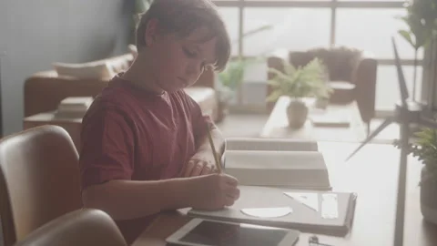 Young Boy Working On Math Problems In Classroom Stock Footage 208804184