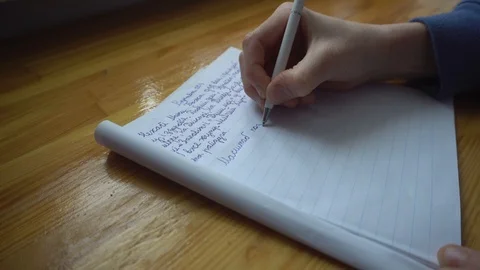 Young Boy Write New Text in Copy Book Video stock 86569496