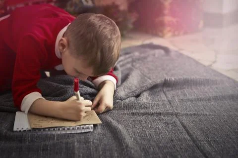 Young boy writing Stock Photos