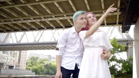 Young boys with bright hair color, blue and pink are considering ahead and show Stock Footage