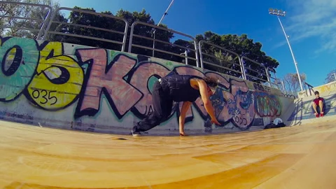 Young boys dancing breakdances in the skatepark, Breakdance Tricks Stock Footage 190649727