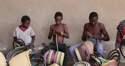 Young boys labor making baskets northern Ghana Africa 4K Stock Footage 153836246