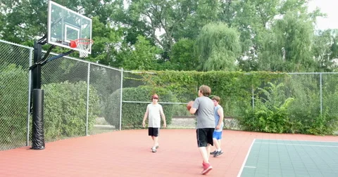 Young boys playing basketball . 4K Video stock 42777066
