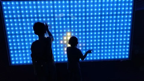 Young boys playing with interactive LED screen 스톡 동영상 108668238