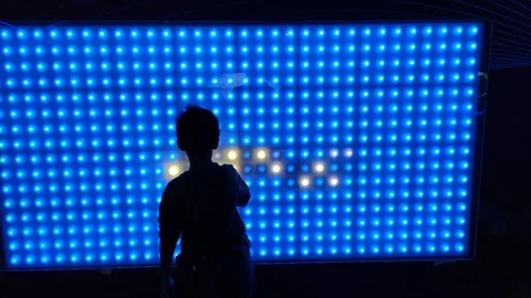 Young boys playing with interactive LED screen 스톡 동영상 108668324
