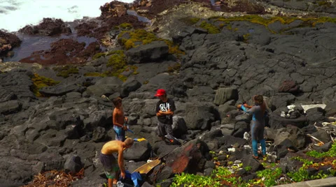 Young Boys Preparing to Spear Fish Stock Footage
