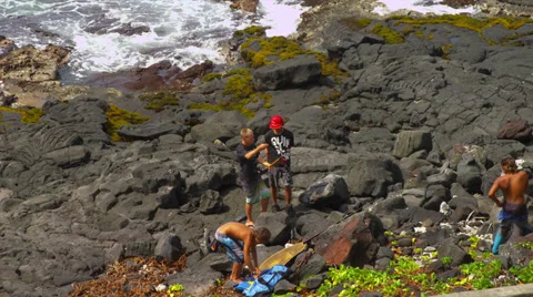 Young Boys Preparing to Spear Fish Stock Footage 35226258