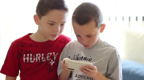 Young boys using smartphone 動画素材 40712202