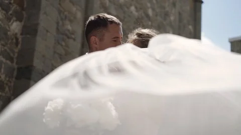 Young bride and groom posing in a city. Video stock 103503763