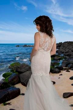 Young bride on beach. Foto stock