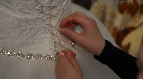 Young bride getting dressed into her wedding gown Stock Footage 52190142