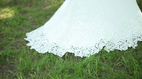 Young bride in the park, forest. wedding dress with train. Stock Footage 50978422