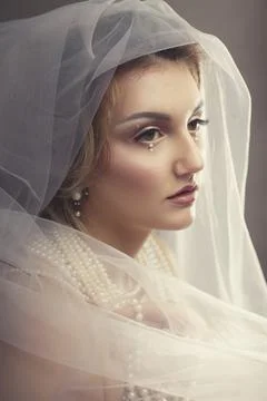 Young bride in veil Stock Photos