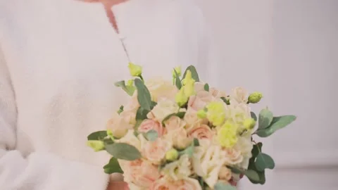 A young bride with a wedding bouquet in her hands Stock Footage 328049276