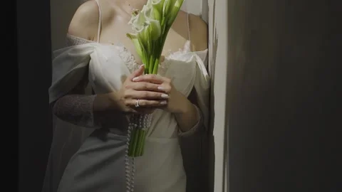A young bride with a wedding bouquet in her hands Stock Footage 329248525