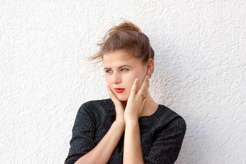Young brooding female with red lips Stock Photos
