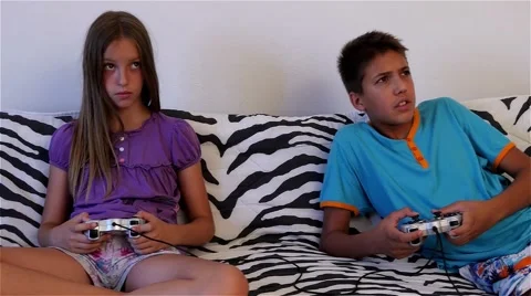 Young brother and sister playing video g... | Stock Video 